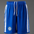 Blue athletic RETRO shorts with white side stripes and a Chelsea FC crest on the left leg, displayed on a mannequin against a gray background. 
