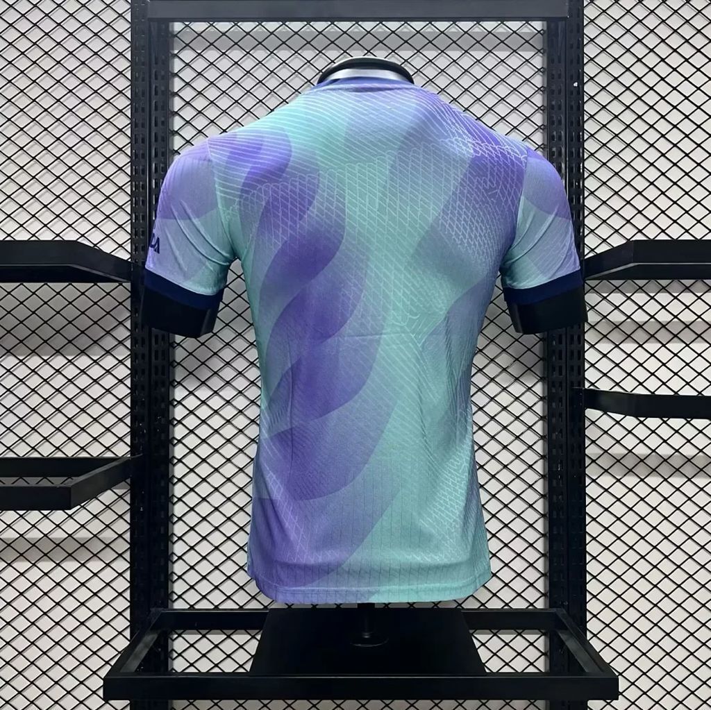 Arsenal third player football jersey back view, light blue/purple abstract pattern, short sleeves