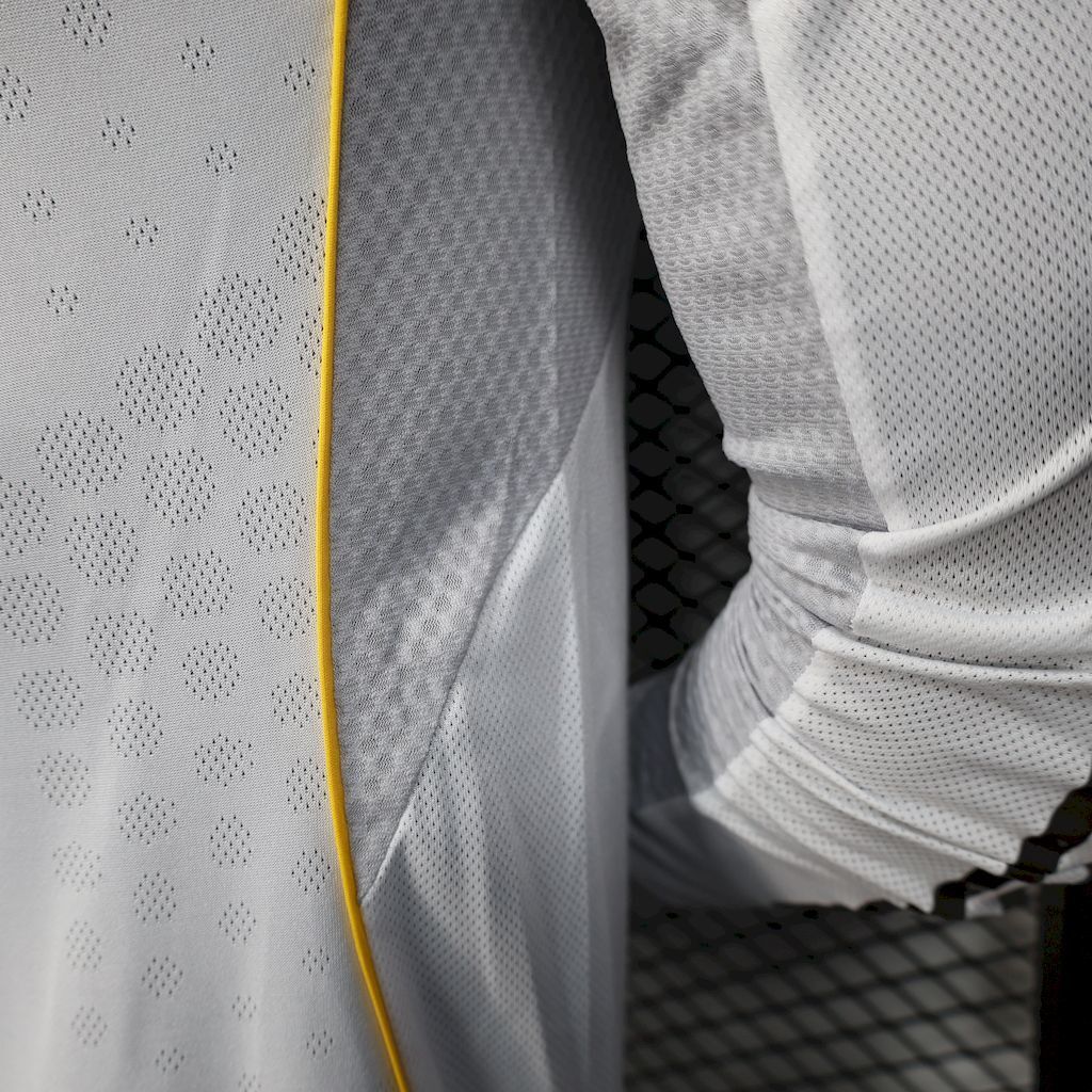 Real Madrid home jersey side seam and sleeve, white fabric with yellow piping