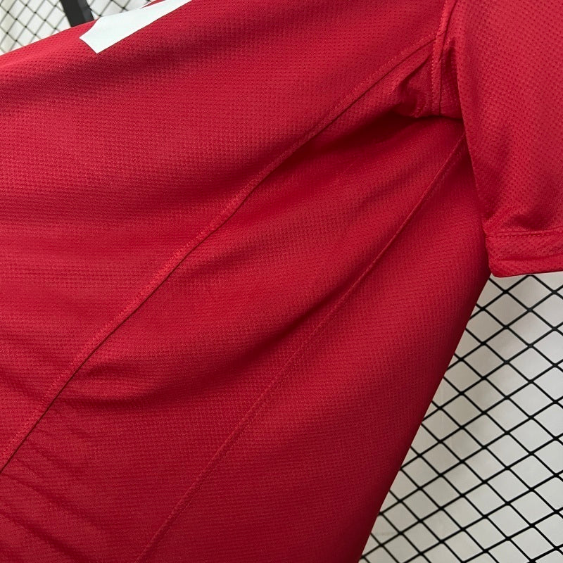 Red soccer jersey close-up of side seam and textured fabric