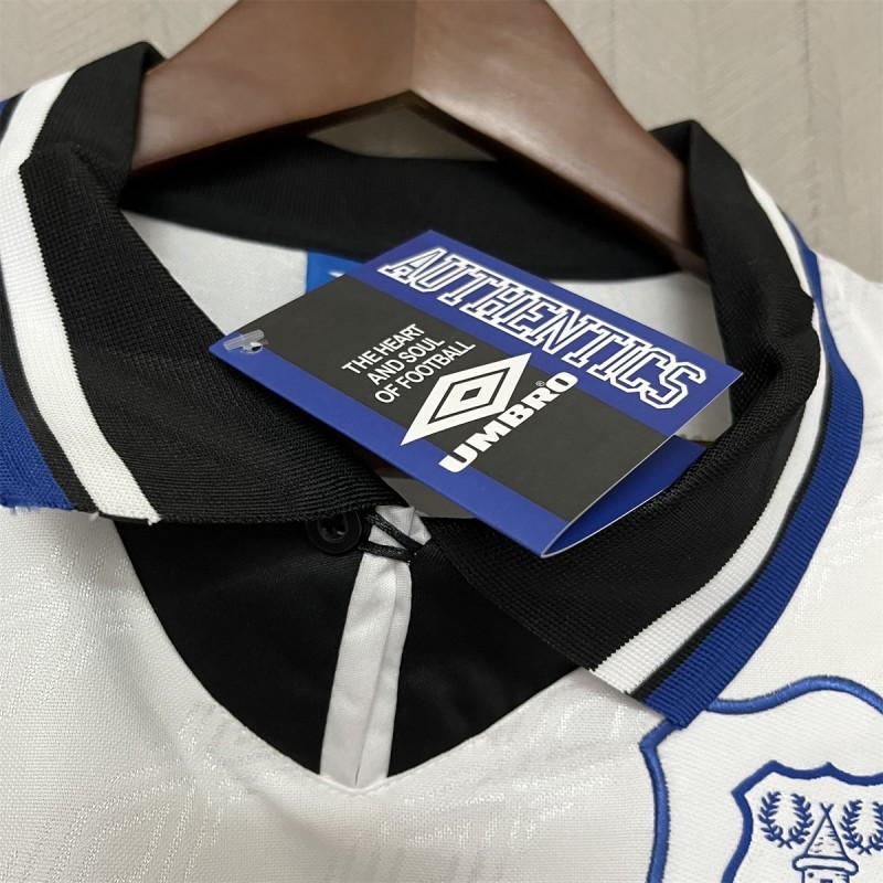 Retro away jersey neckline with Umbro tag and black collar, blue trim, white and black panels