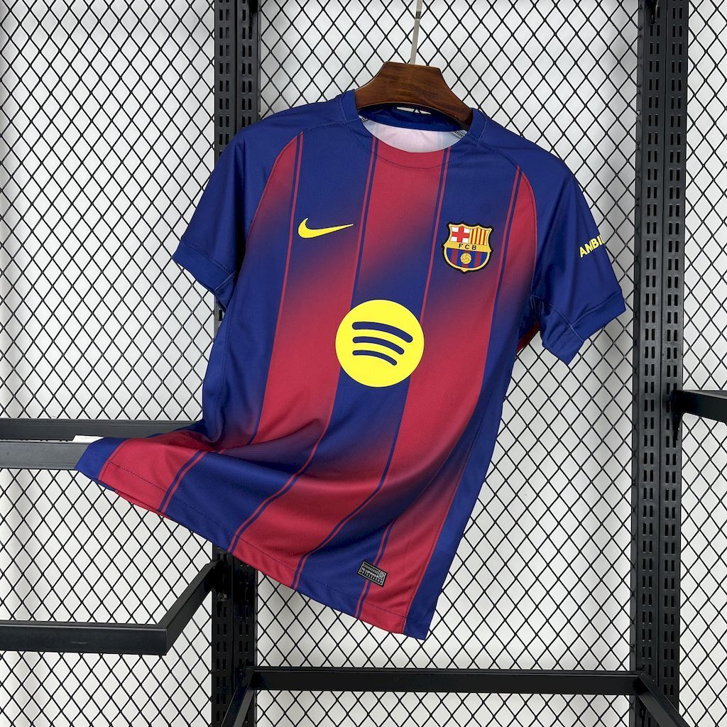 Barcelona home fan football jersey, blue with red vertical stripes and yellow Nike logo