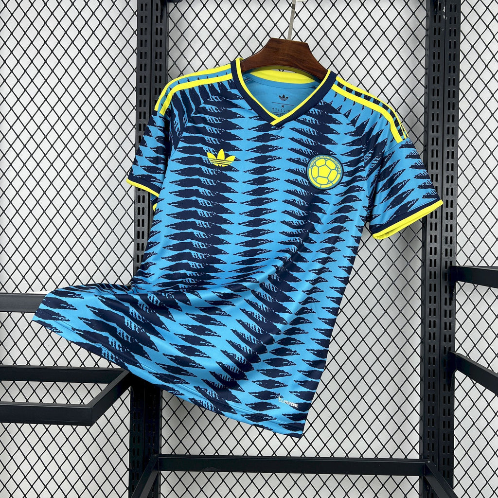 Blue football jersey with yellow trim, bold zigzag pattern, short sleeves and V-neck