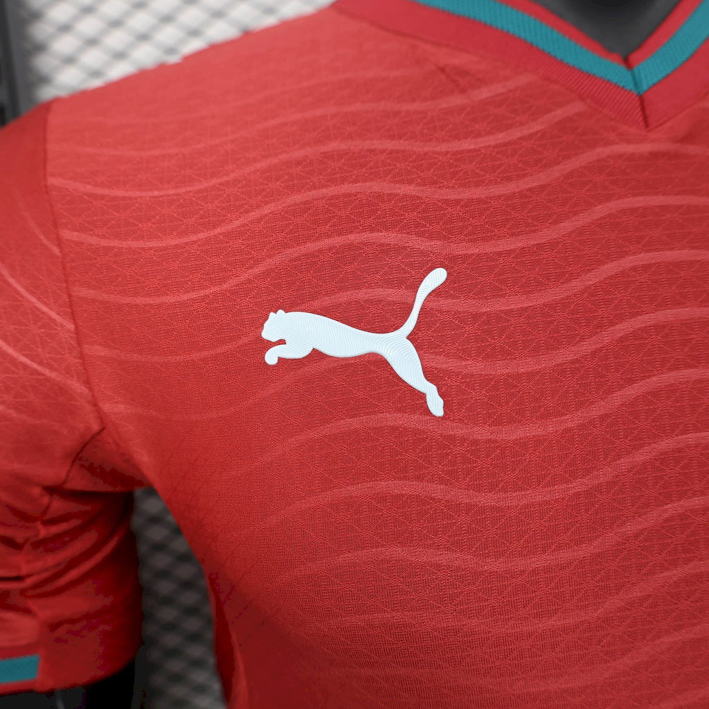 Red soccer jersey with white Puma logo on chest, teal V-neck trim