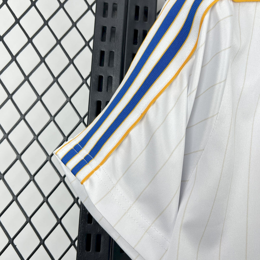 White jersey sleeve with blue stripes and gold side trim