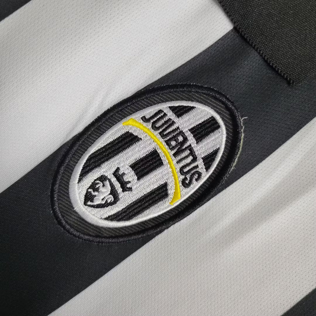 Oval Juventus crest patch on black and white soccer jersey fabric