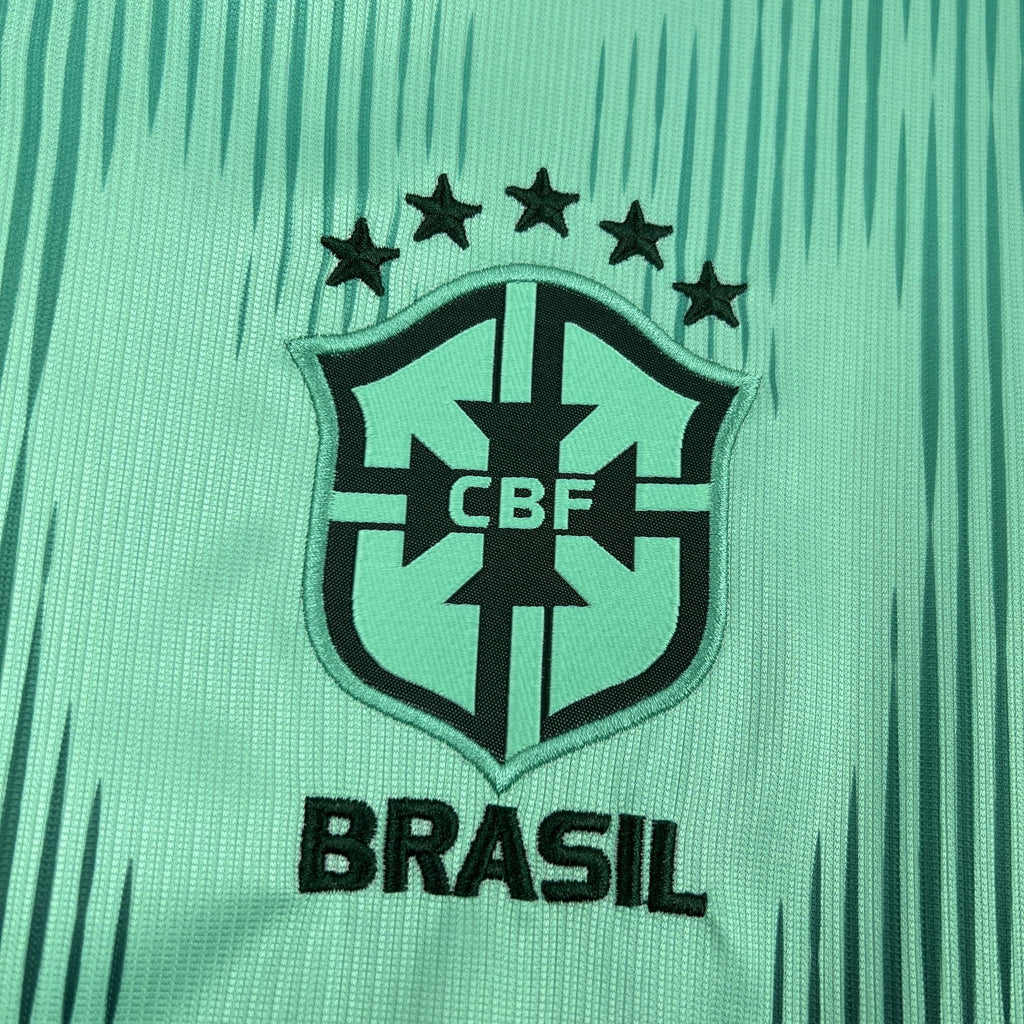 Brazil crest on turquoise goalkeeper jersey with stars and CBF shield
