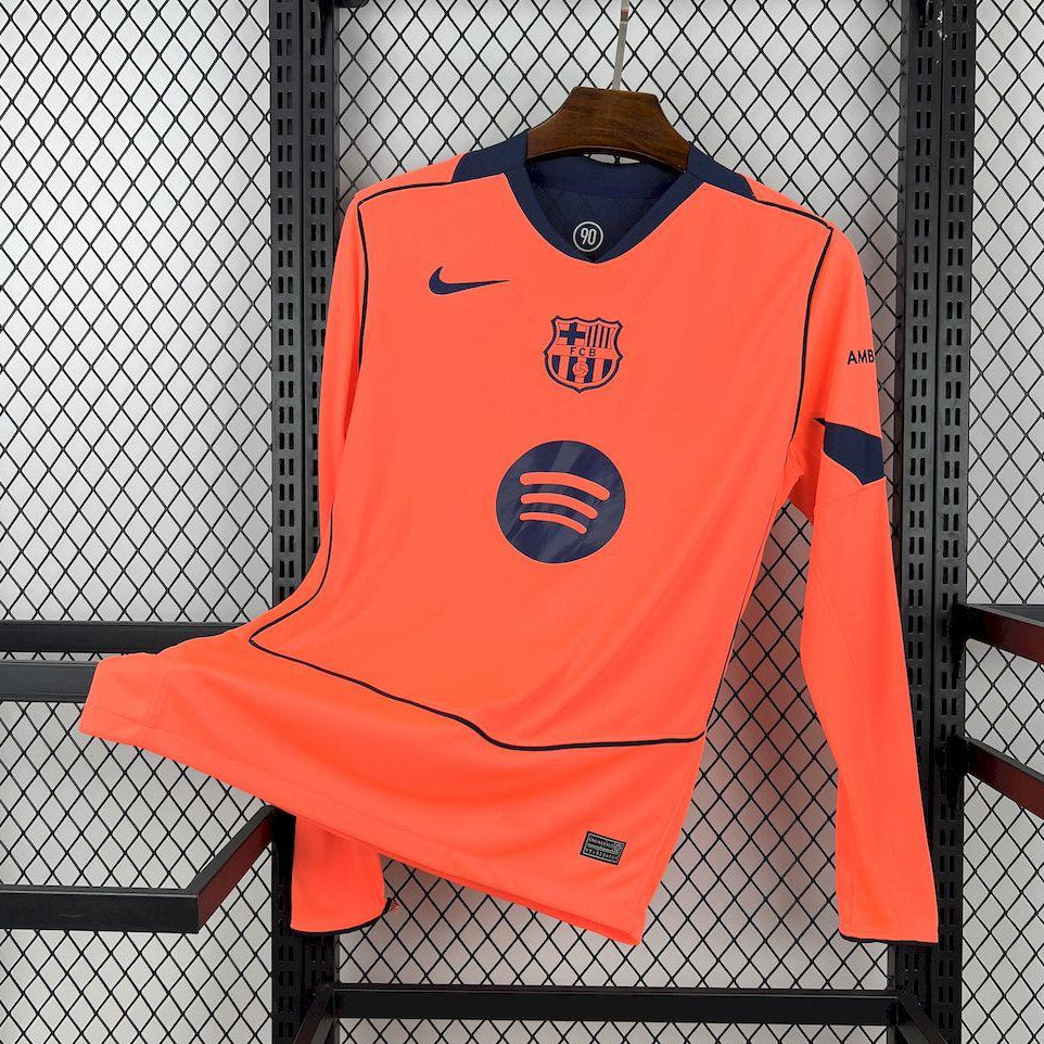 Orange long-sleeve football jersey with Nike swoosh and FC Barcelona crest