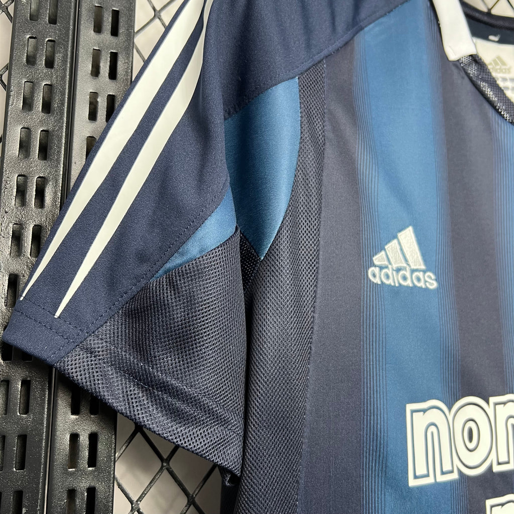 Away soccer jersey sleeve close-up, adidas logo on light-blue panel