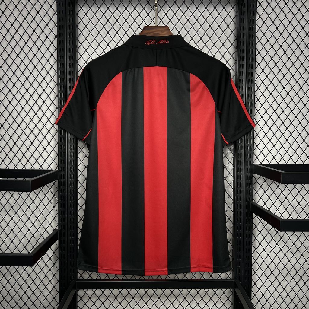 Back view of black and red vertically striped soccer jersey with short sleeves