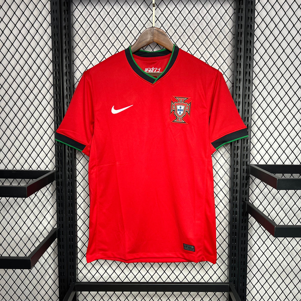Red Portugal home football jersey with V-neck trim, Nike swoosh, and crest