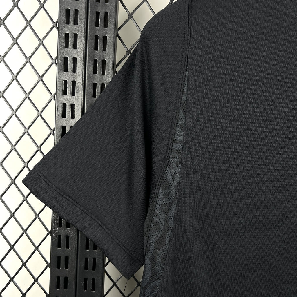 Norway away fan soccer jersey fabric close-up, dark navy texture on sleeve and shoulder