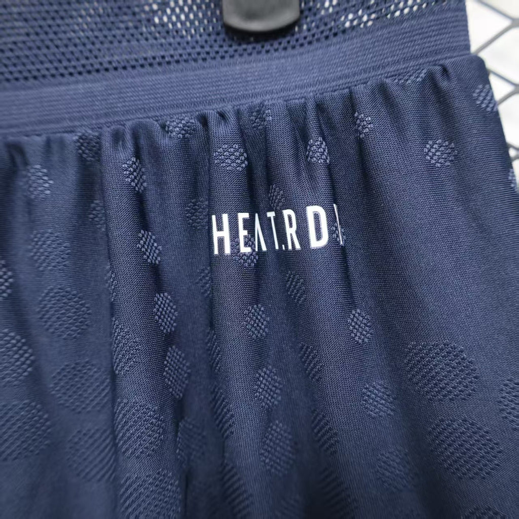 Navy player shorts waistband with gathered elastic and HET.RD printed label