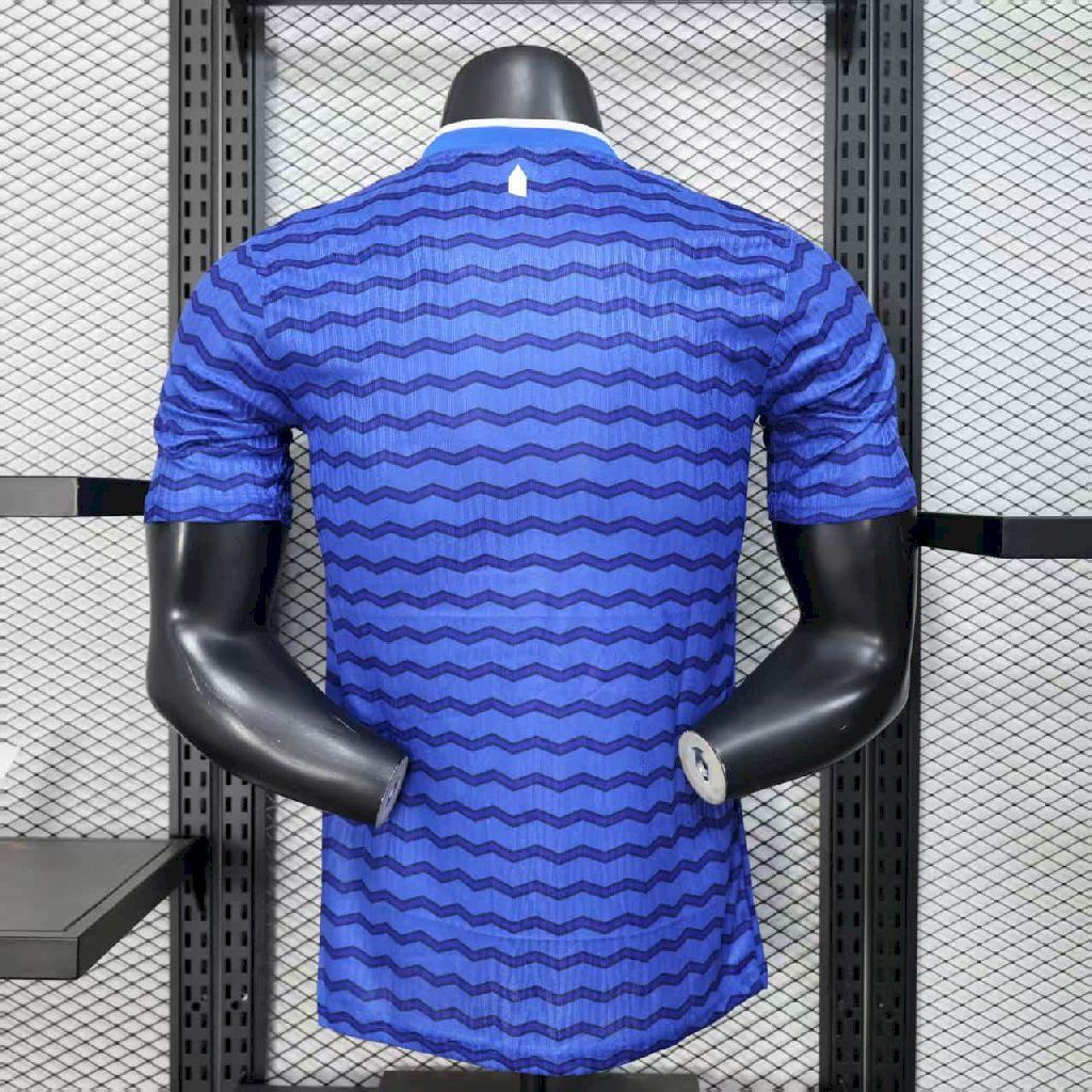 Blue striped soccer home jersey, short sleeves, crew collar, back view on torso.