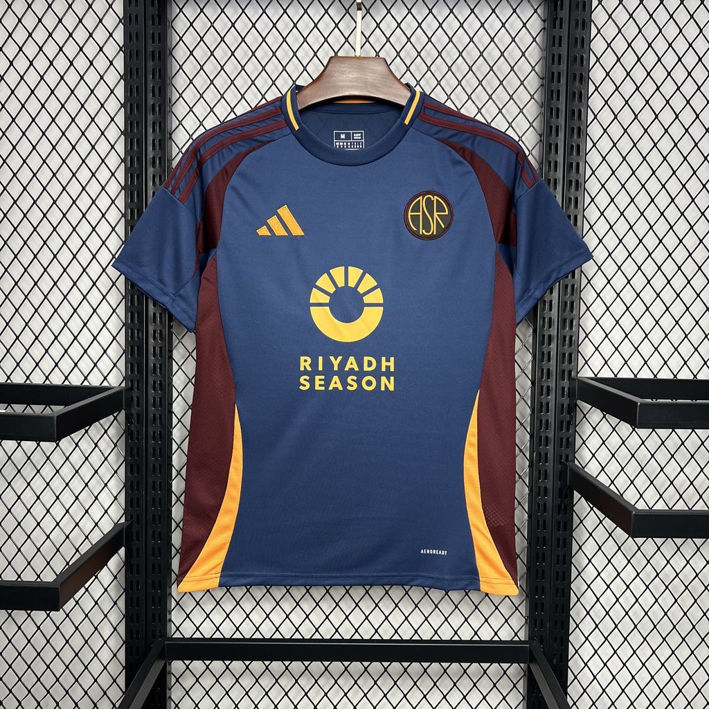 Blue and maroon soccer fan jersey with yellow trim, front crest, and Riyadh Season text