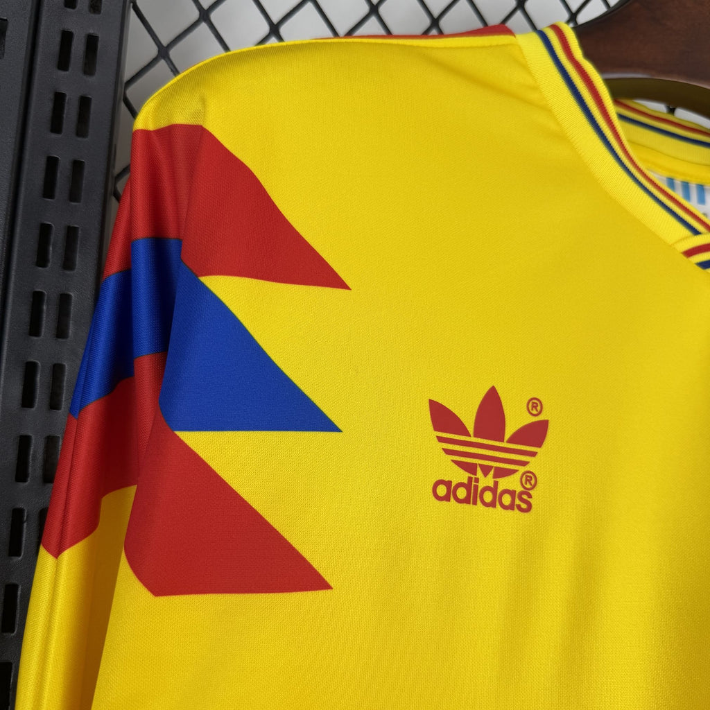Yellow Colombia jersey with adidas logo and red-and-blue geometric shoulder accents
