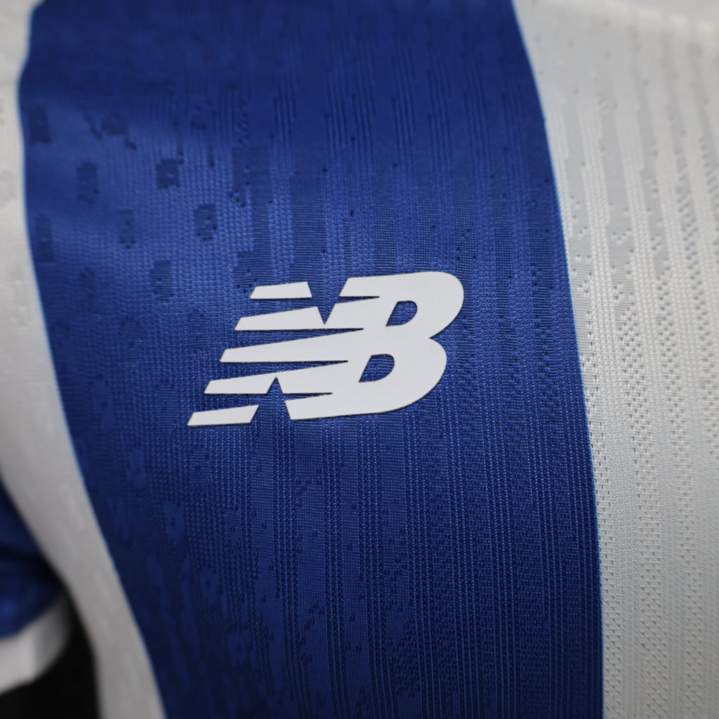 NB logo on blue football jersey front panel with white vertical stripe
