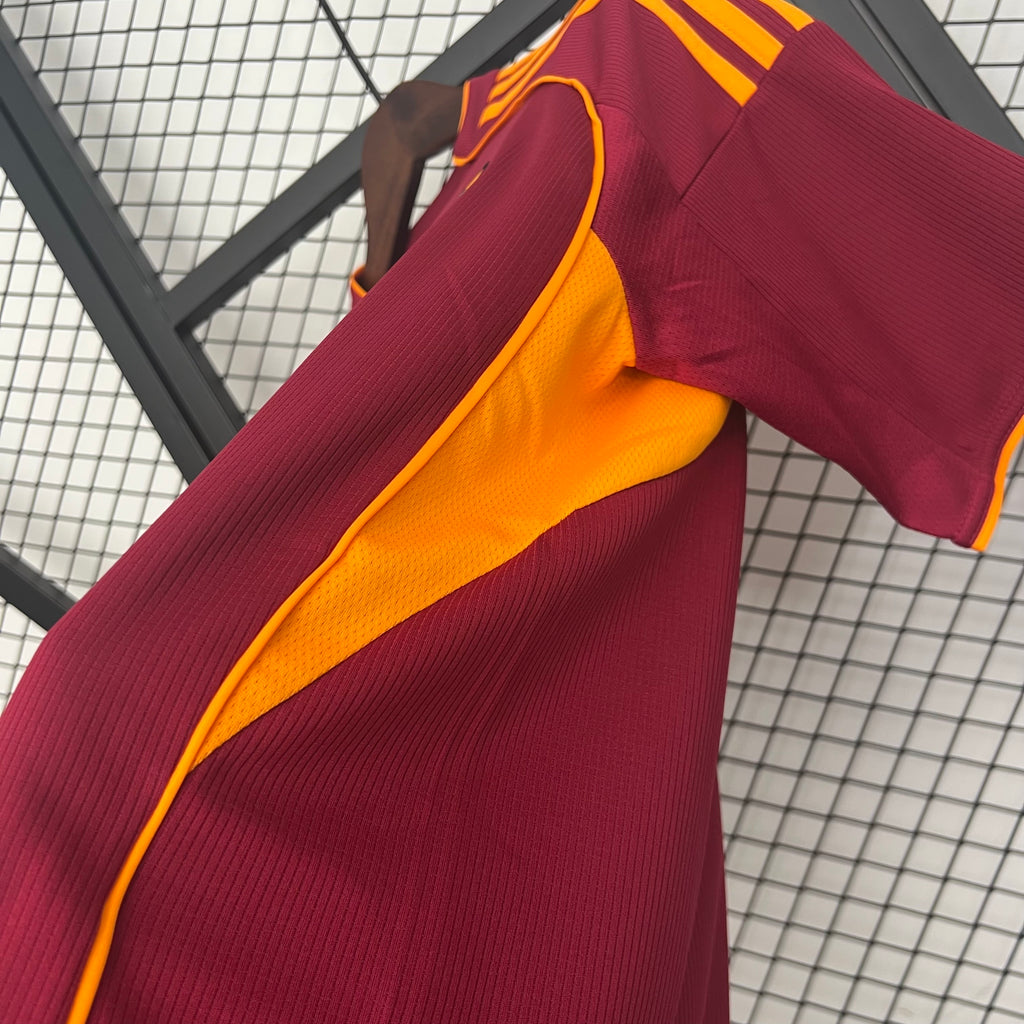 Maroon soccer jersey sleeve with yellow panel and ribbed texture trim