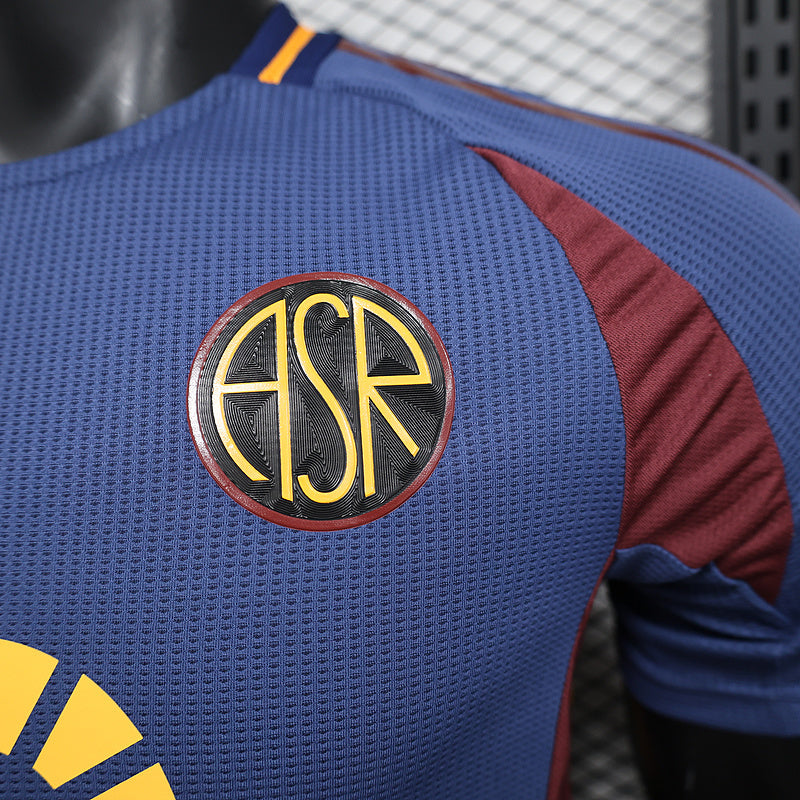 Blue jersey back close-up with round A S R crest emblem and maroon stripe