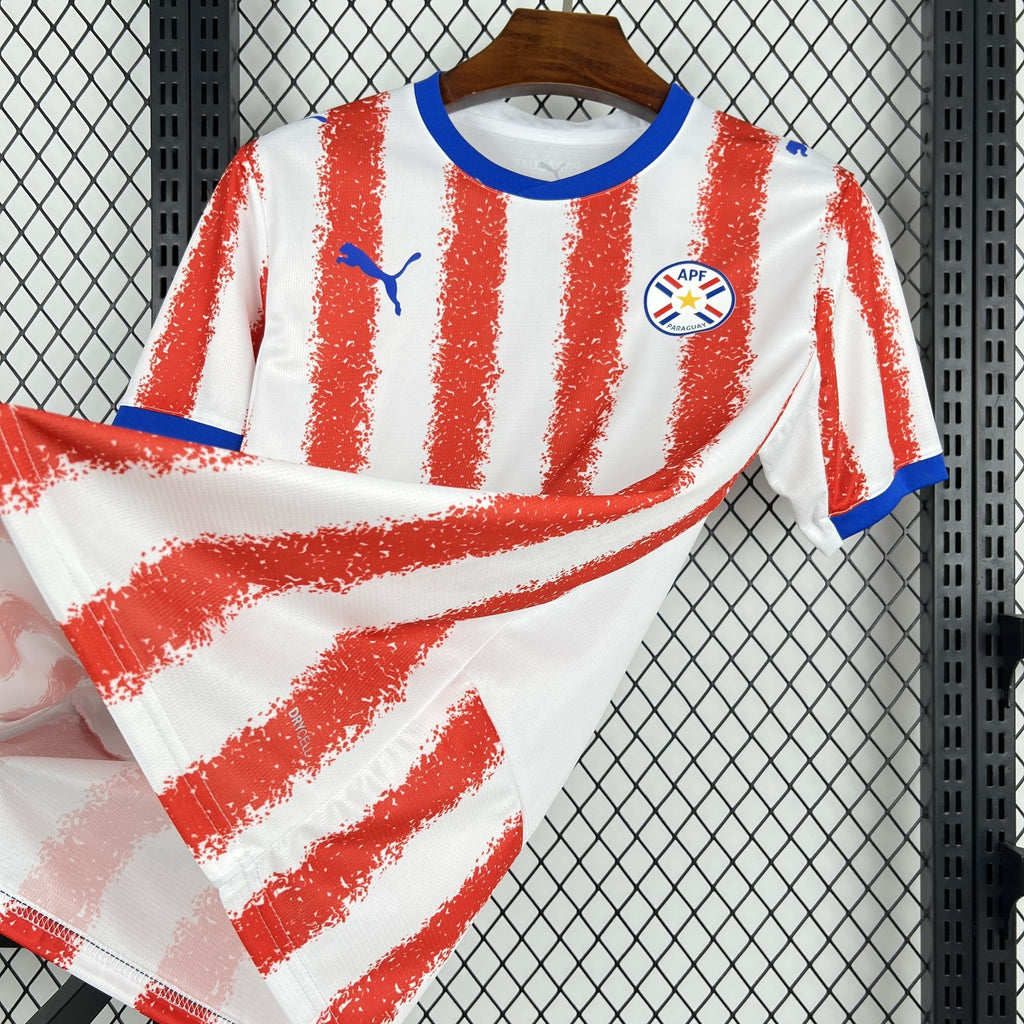 Paraguay home fan soccer jersey front view with red stripe pattern and blue collar trim