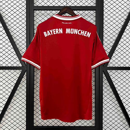 Red retro home soccer jersey back view with white striped trim and “Bayern Munchen” text