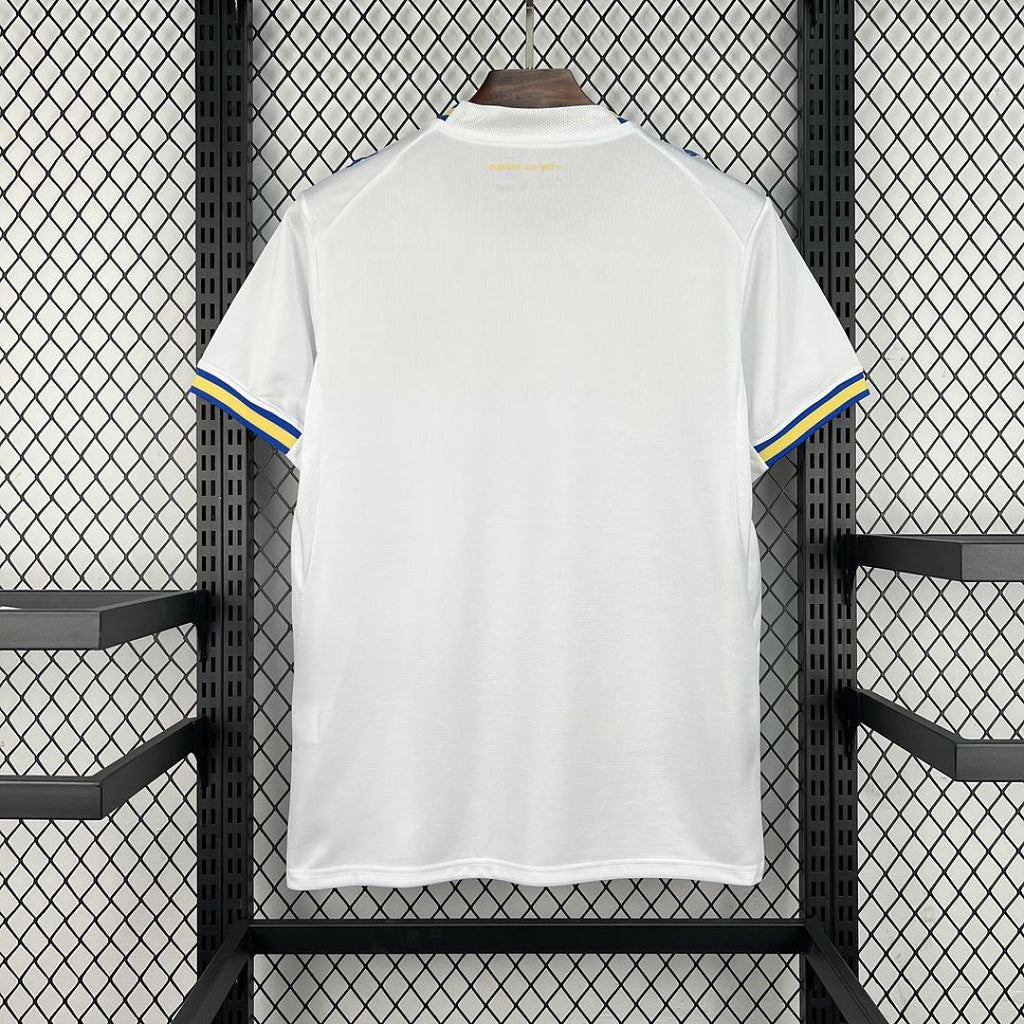 Back view of white home fan football jersey with blue and yellow collar stripes