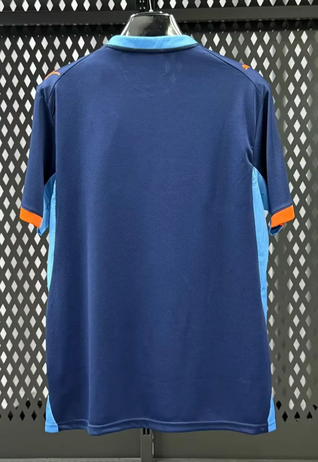 Blue football jersey back view with orange collar and sleeve cuffs