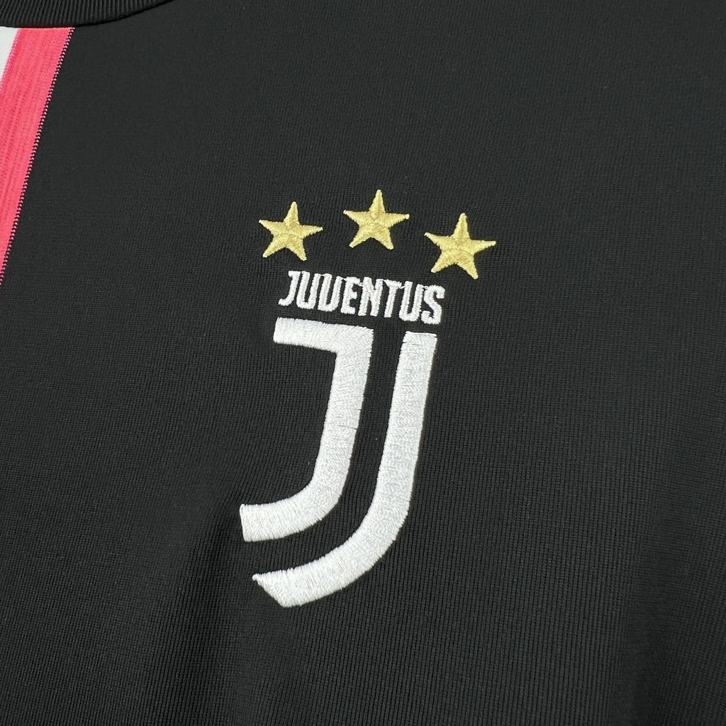 Juventus crest with three gold stars on black jersey front
