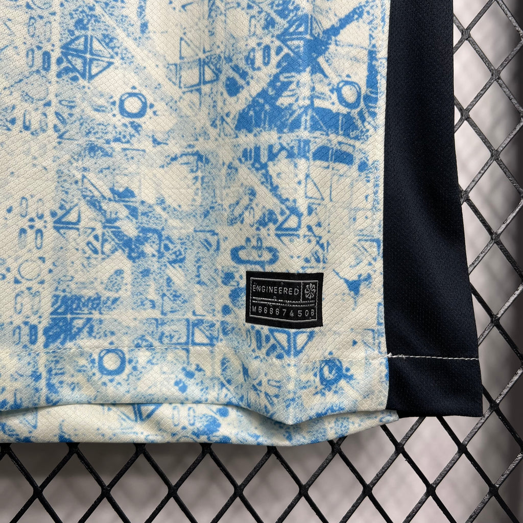 Light blue geometric fan jersey with black hem and small size label