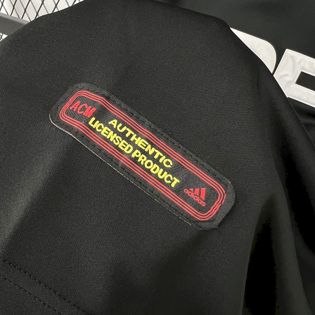 Black jersey with red authenticity label reading Authentic Licensed Product