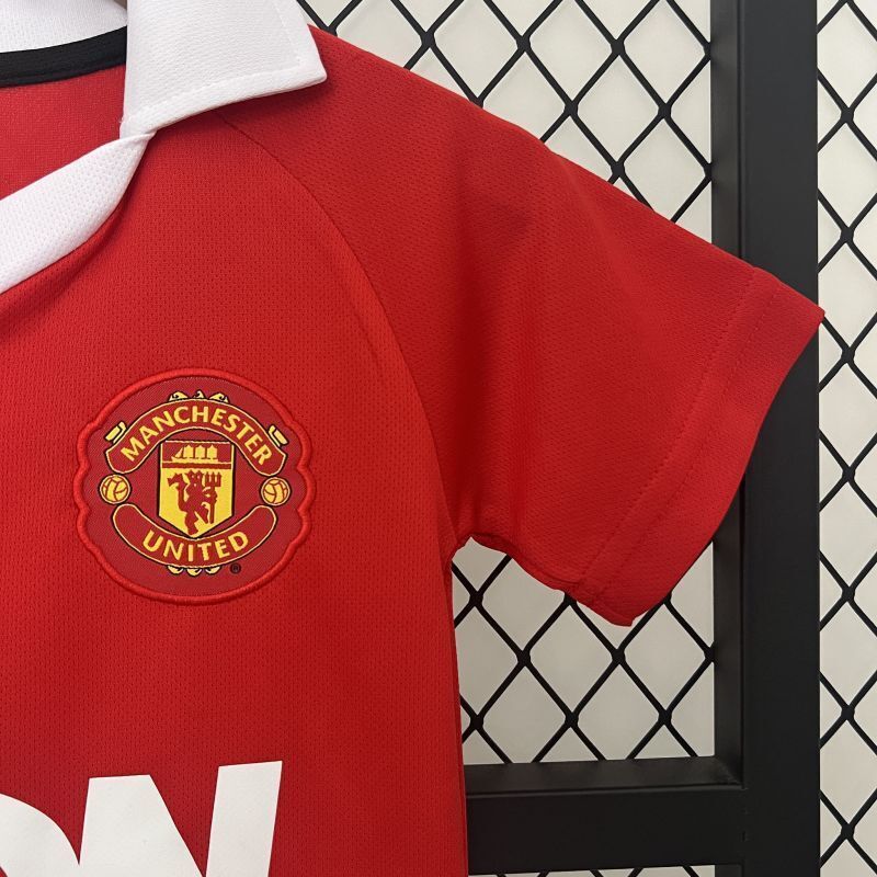 Red jersey sleeve with Manchester United crest patch