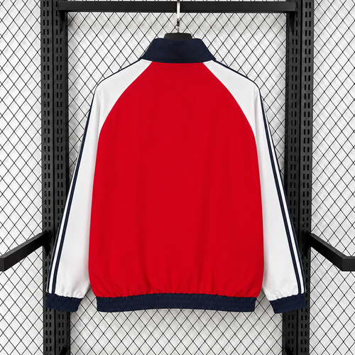 Red windbreaker jacket back view with white side panels and navy trim