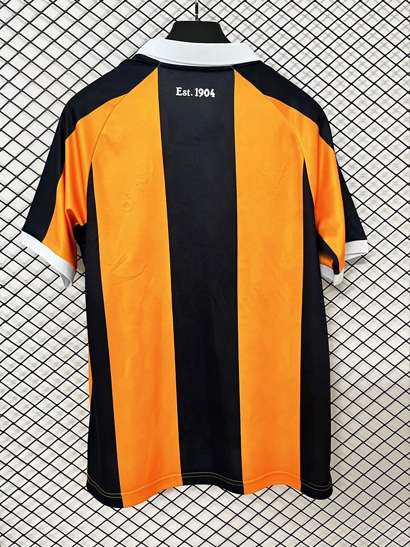 Home fan football shirt back view with orange and black stripes and "Est. 1904"