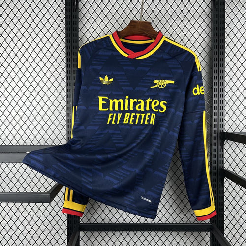Navy long-sleeve football jersey with yellow and red trim, Emirates Fly Better print