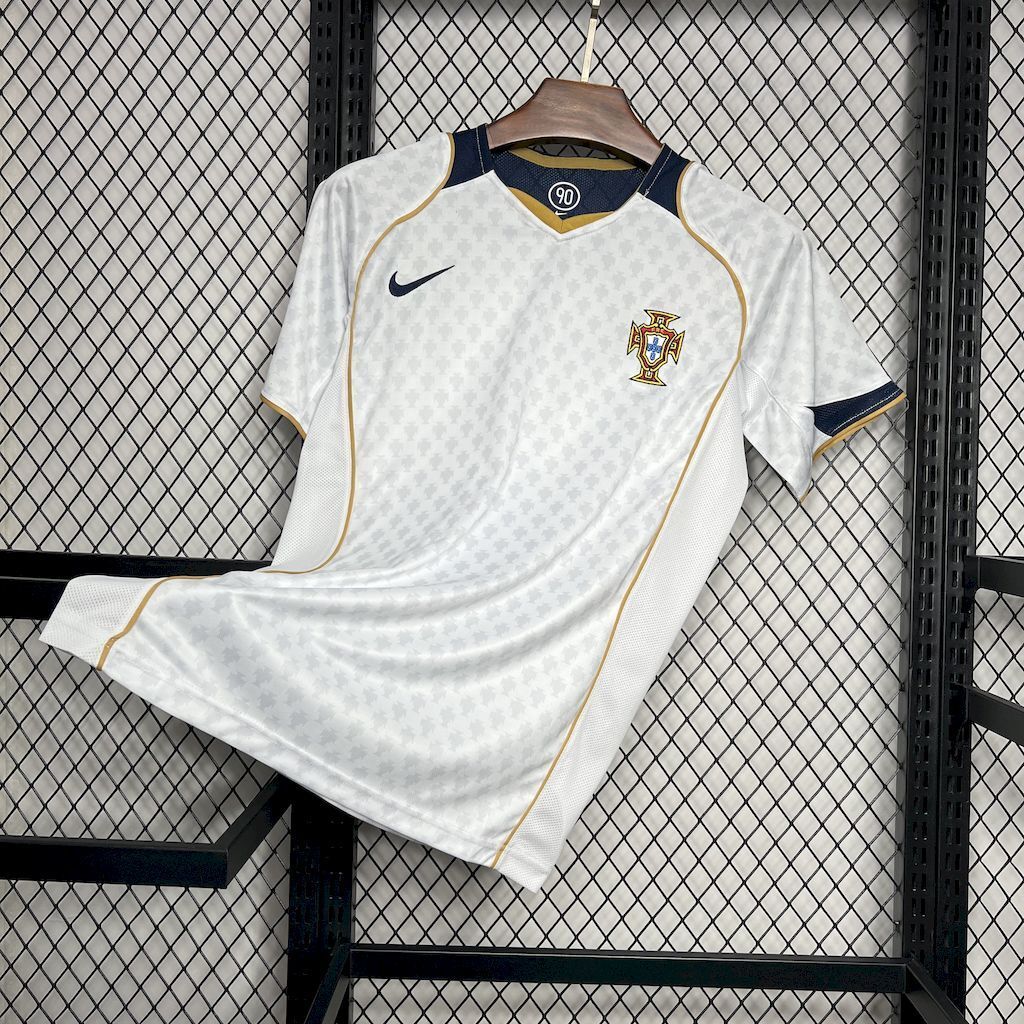 White Portugal away soccer jersey front with crest, navy sleeve trim, gold piping