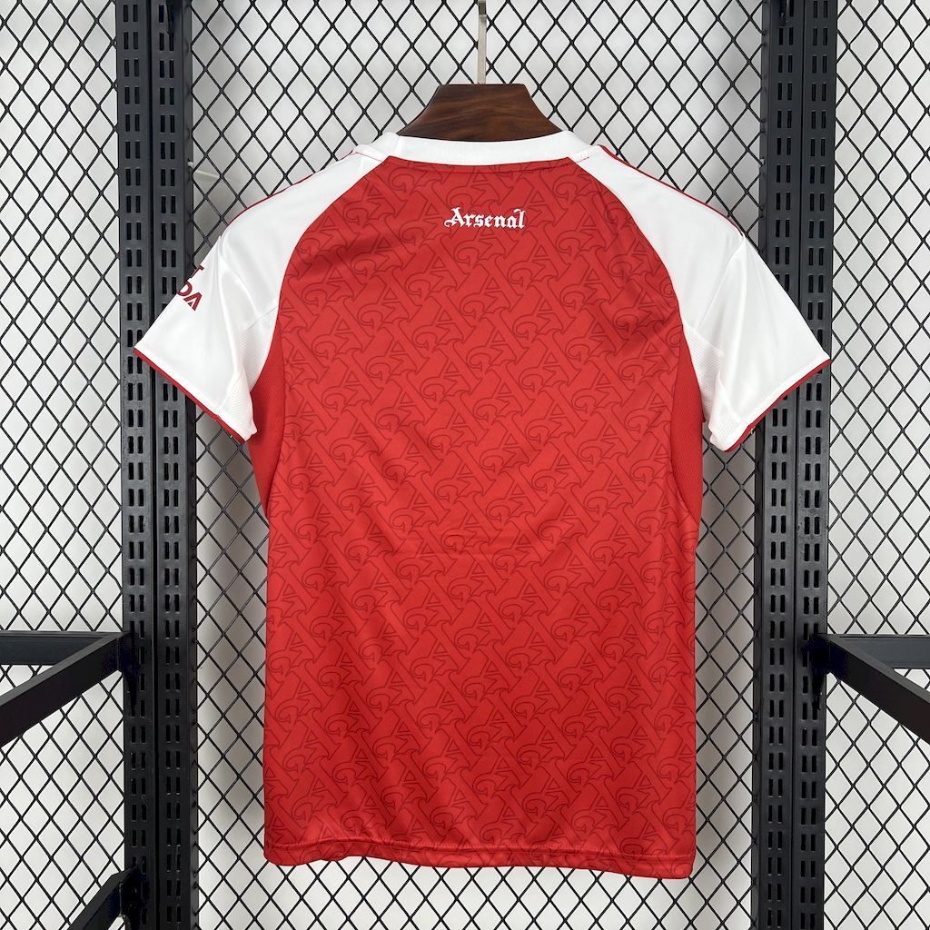 Red women’s home football shirt with white raglan sleeves and Arsenal crest on back