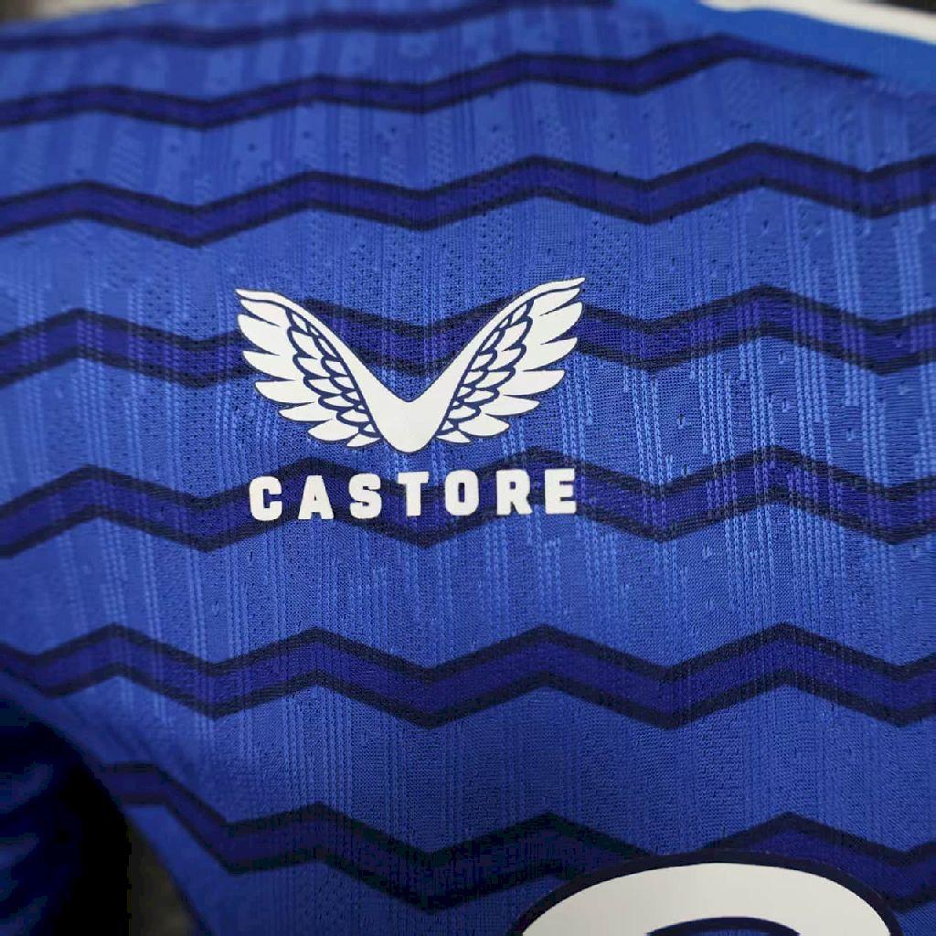 Blue soccer jersey with zigzag stripes and Castore wing logo on chest