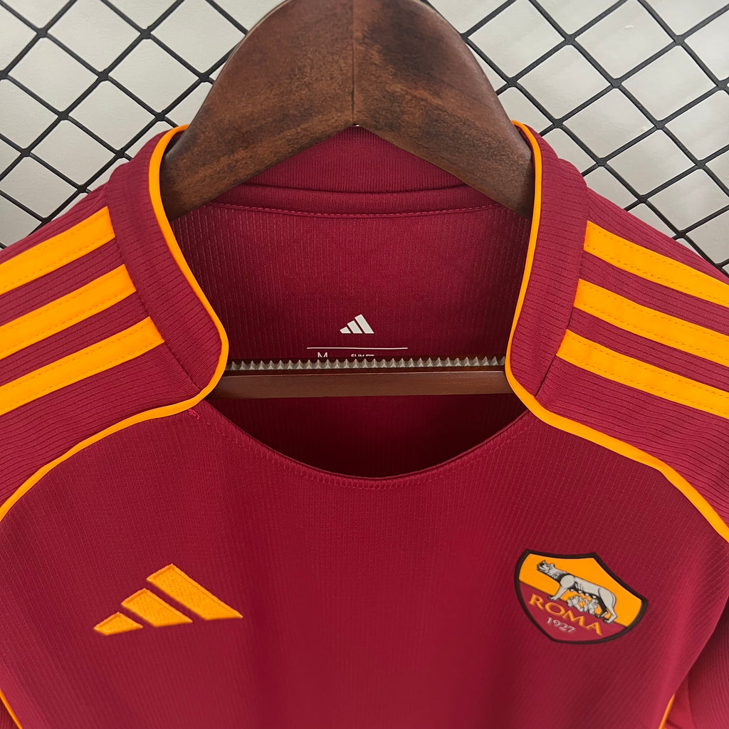 Maroon soccer jersey collar with yellow piping and small adidas logo