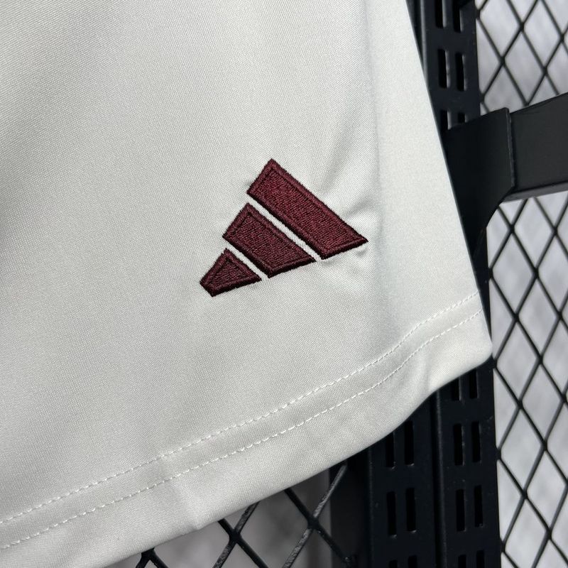 White shorts with maroon stitched logo on side