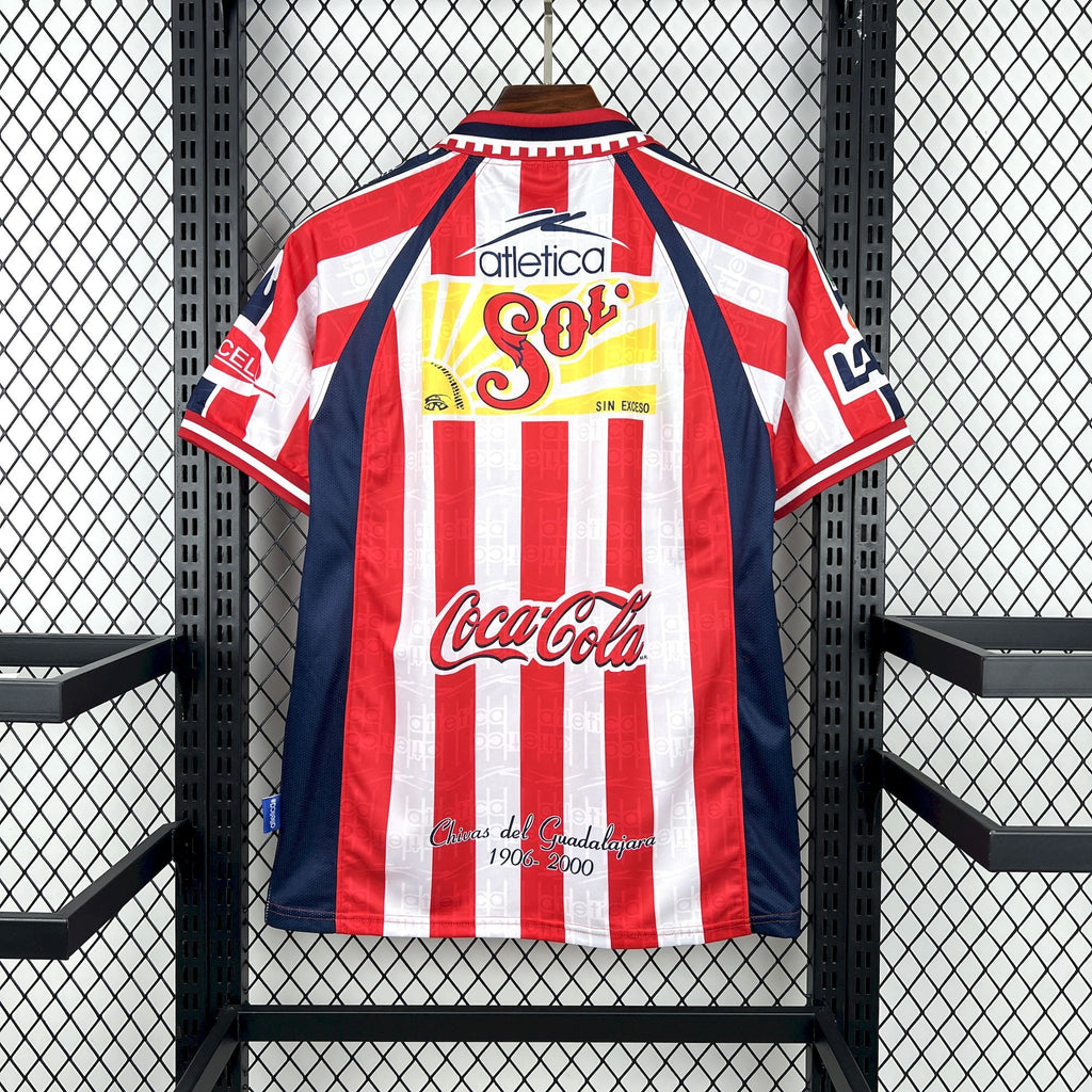 Retro home soccer jersey back view in red and white stripes with blue accents and sponsor print