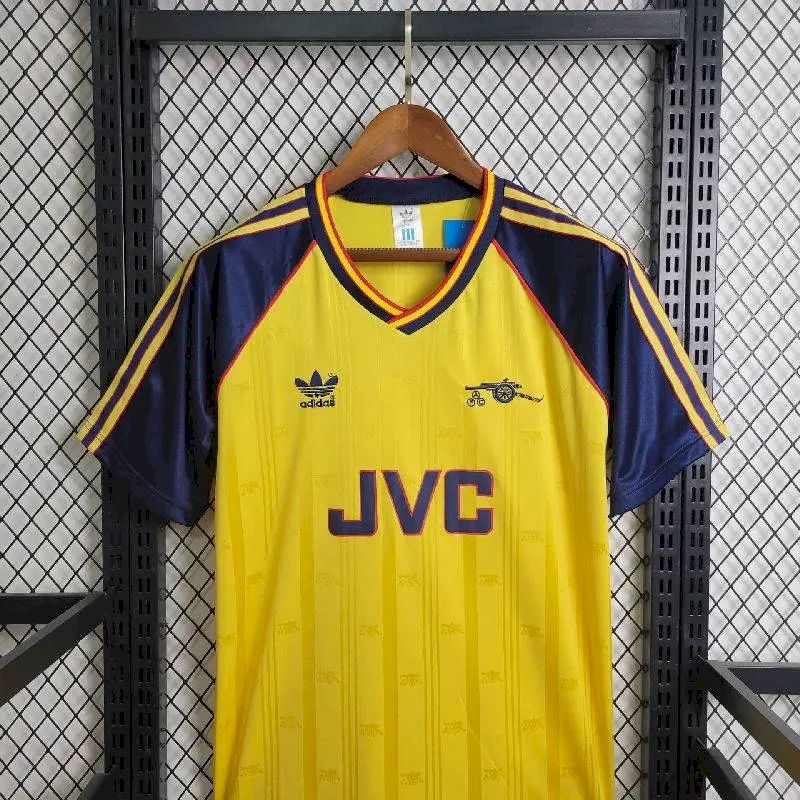 Yellow and navy retro football jersey with JVC sponsor, Arsenal crest, and adidas marks