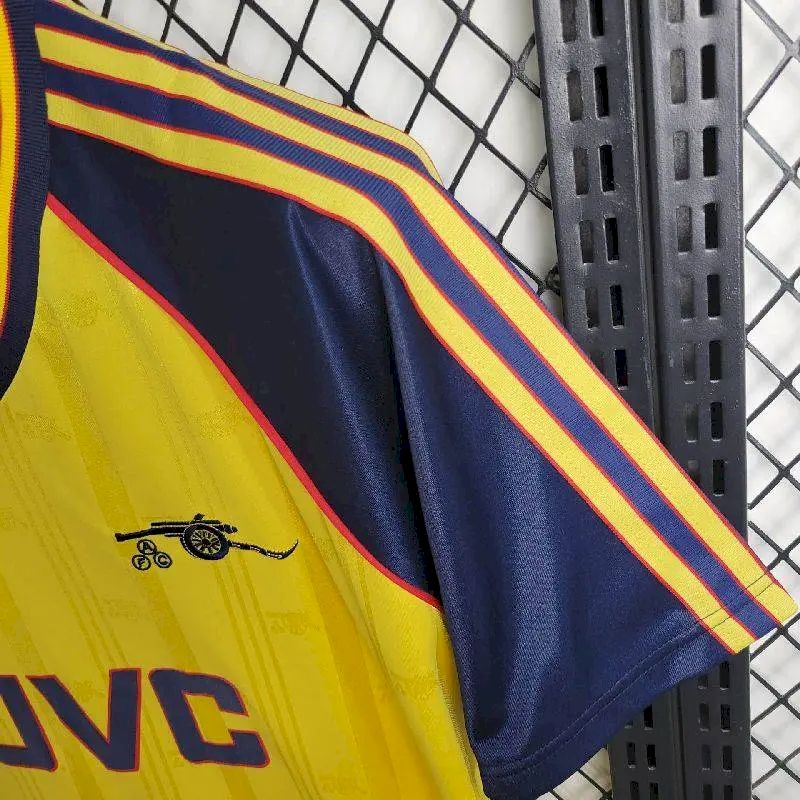 Navy and yellow retro football jersey sleeve with red-and-yellow shoulder stripes