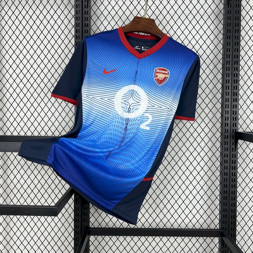 Blue retro football away jersey with red trim, Arsenal crest, and player number 2