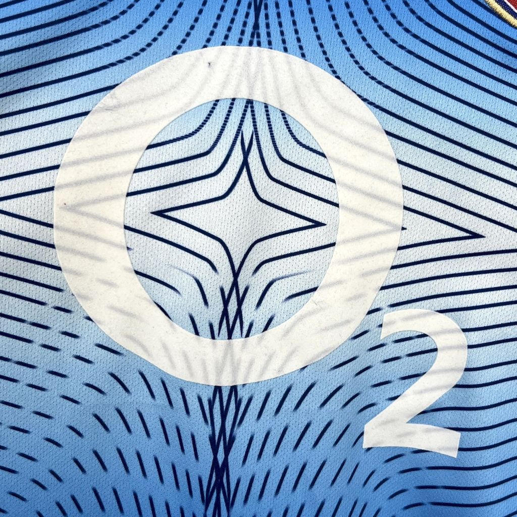 Blue jersey close-up with white star graphic and number 2