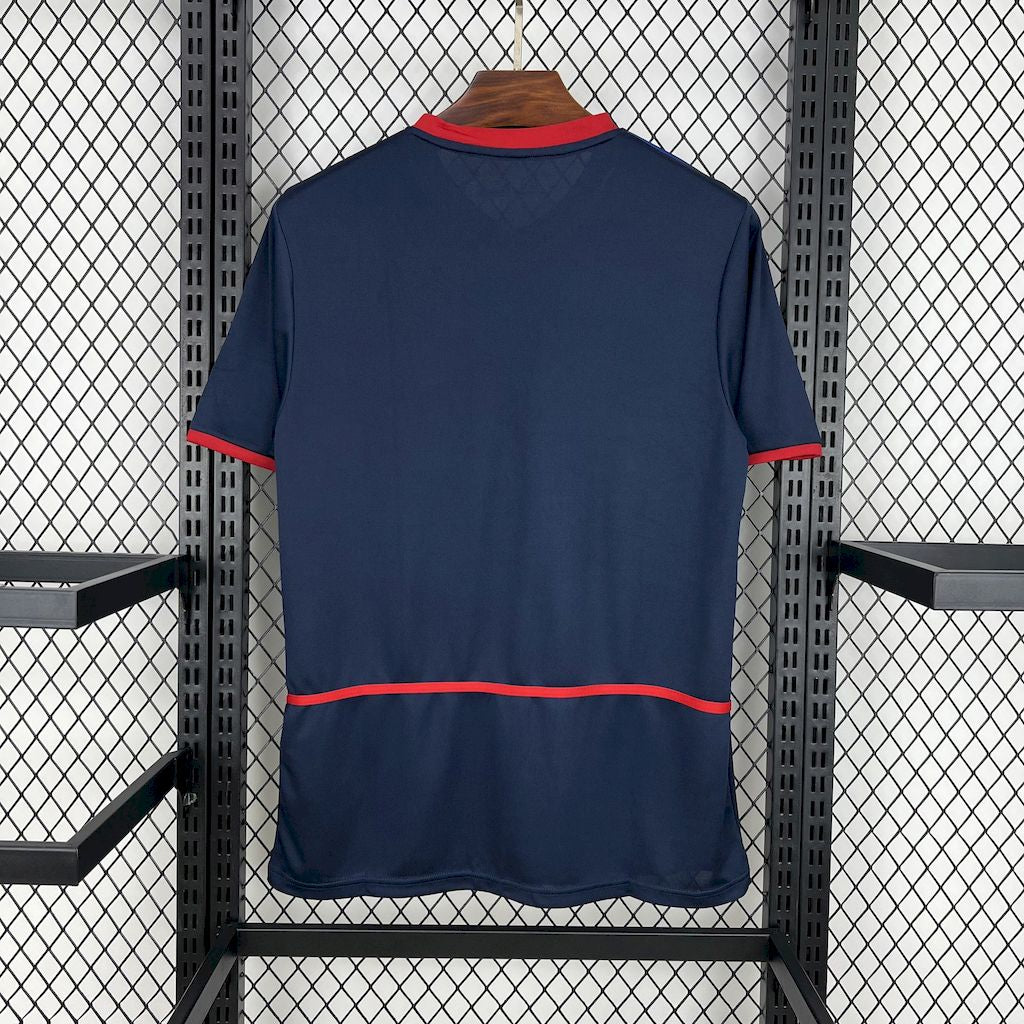 Blue retro football away jersey back view with red collar trim and hem stripe
