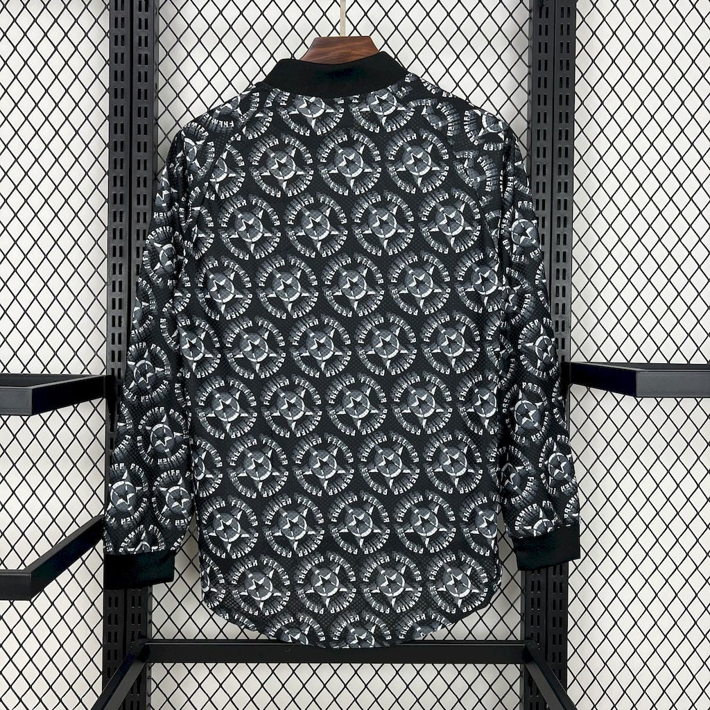 Black long-sleeve goalkeeper jersey with repeating geometric pattern, back view