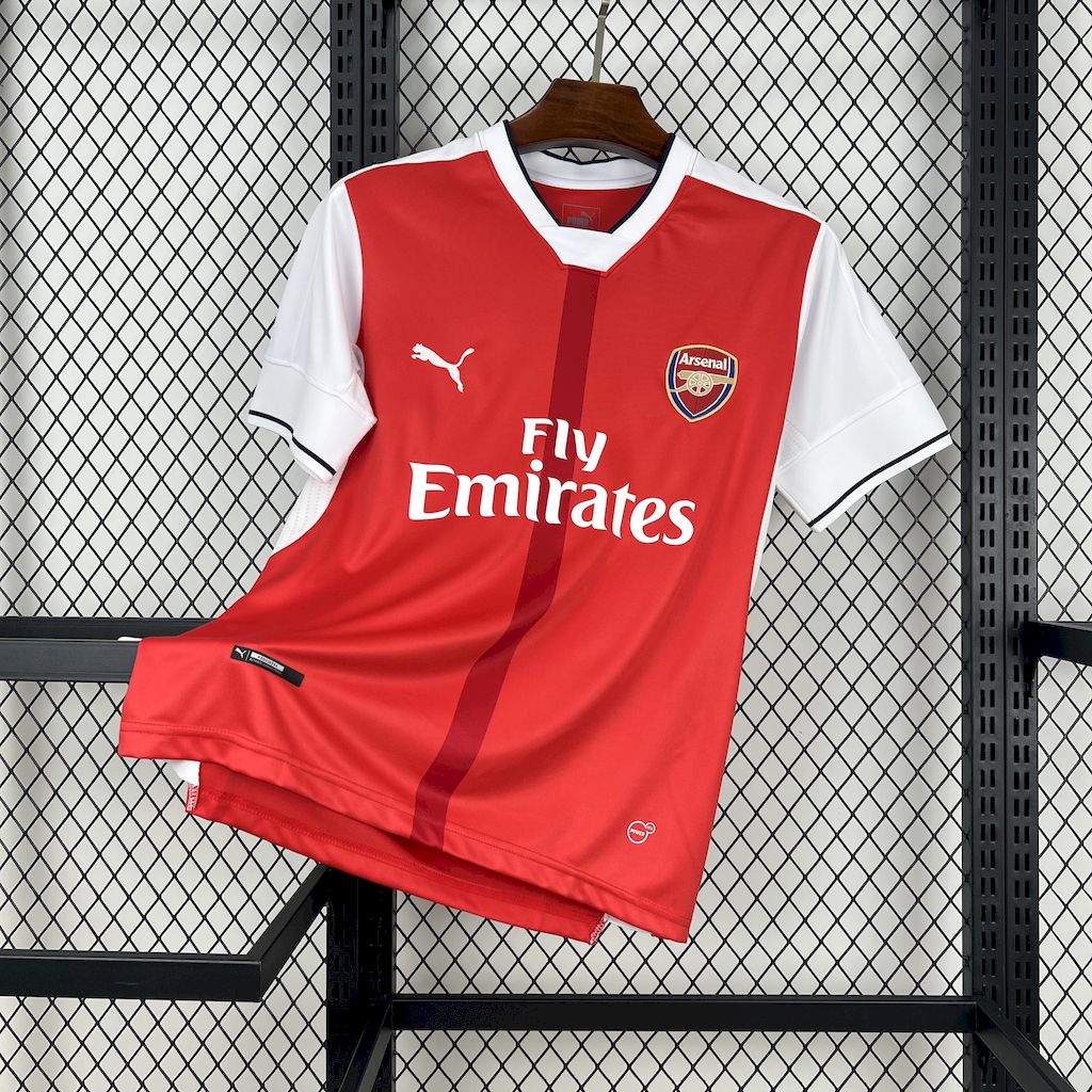 Red and white retro soccer jersey with V-neck, Fly Emirates text, Arsenal crest