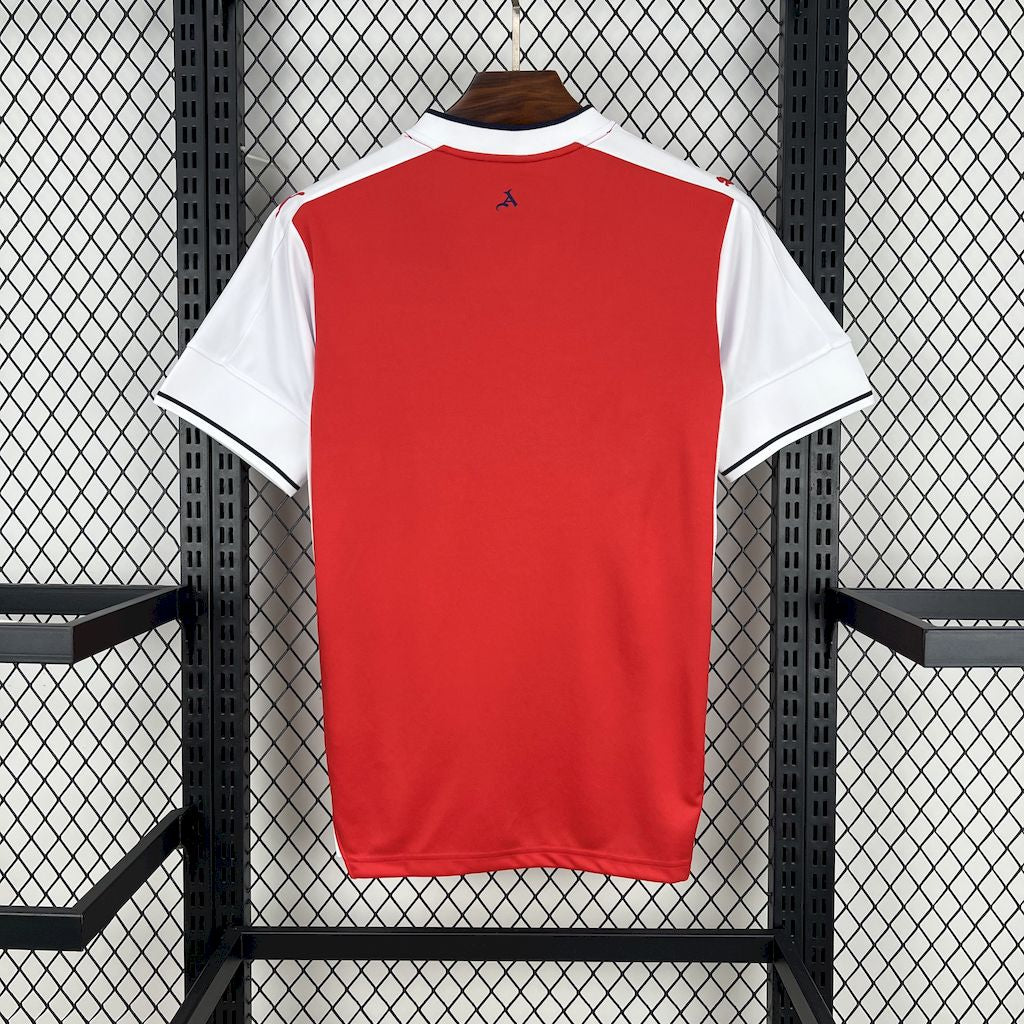 Red retro soccer jersey back with white sleeves and small Puma logo