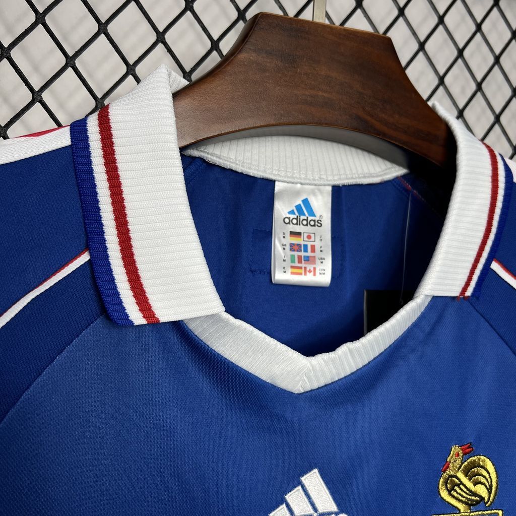 Blue France jersey neckline detail with white ribbed collar and red stripe trim.
