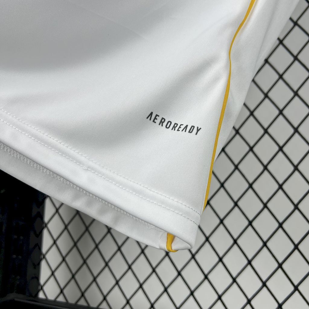 White jersey fabric close-up with AEROREADY text and yellow piping